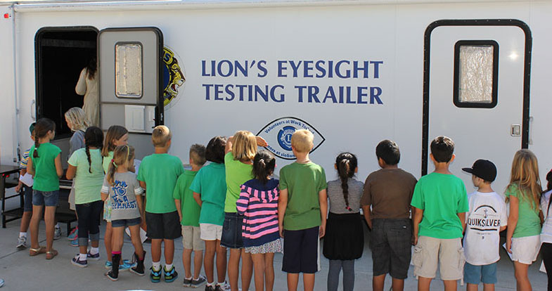 Lions Eye Testing KIDS LINE UP AT TRAILER WS 9-13-13 Smaller